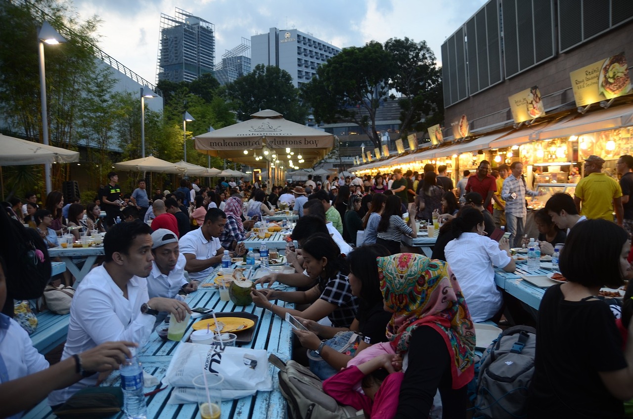 People eating at outside tables in Singapore